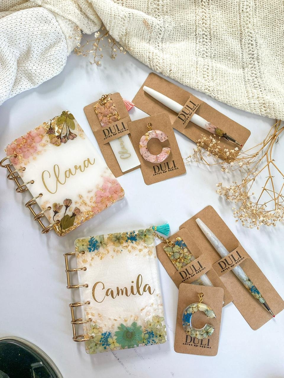 White resin notebook with purple flowers and gold leaf